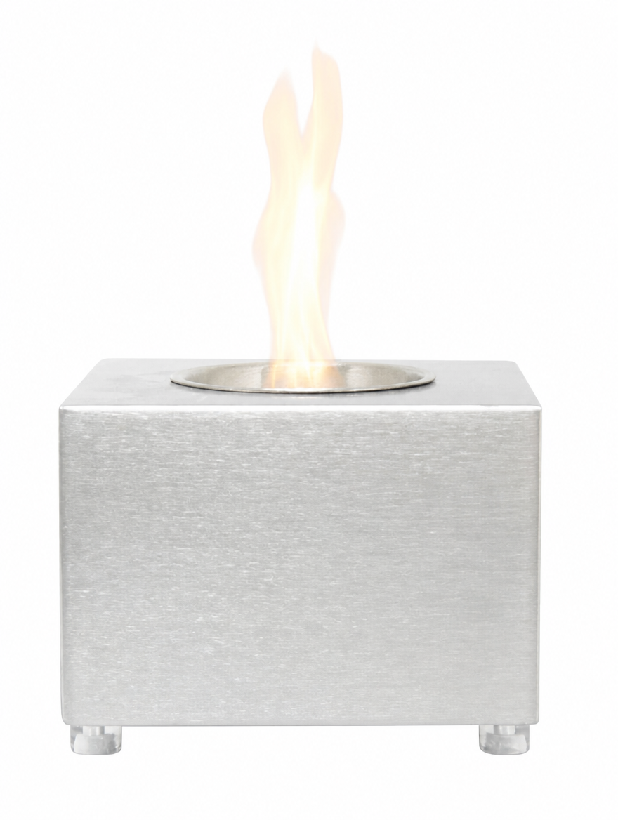 Cube tabletop bioethanol fireplace in stainless steel with lit flame, front view showing the feet