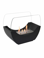 Cradle black tabletop bioethanol fireplace with a lit flame, white studio background