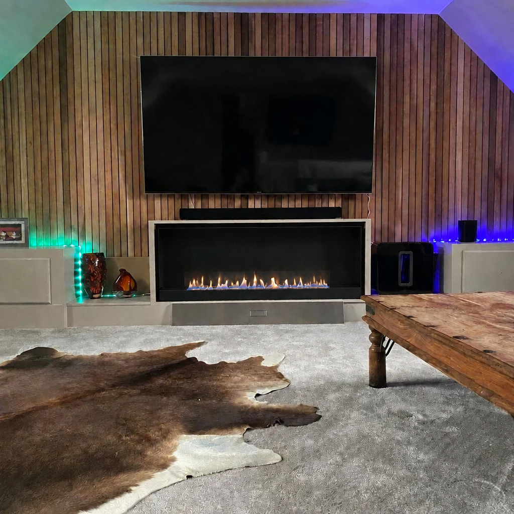 ScandiFlames 140cm black built-in bioethanol fireplace under a TV in a living room, lit with a realistic low flame correctly scaled to the true 95cm burner width within the 140cm opening